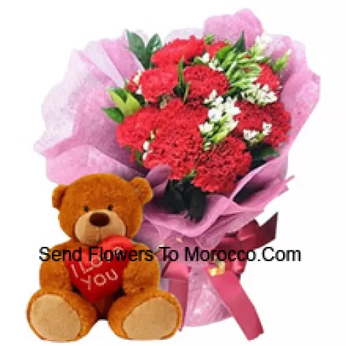 Bunch Of 11 Red Carnations With Seasonal Fillers Along With A Cute 12 Inches Tall Brown Teddy Bear