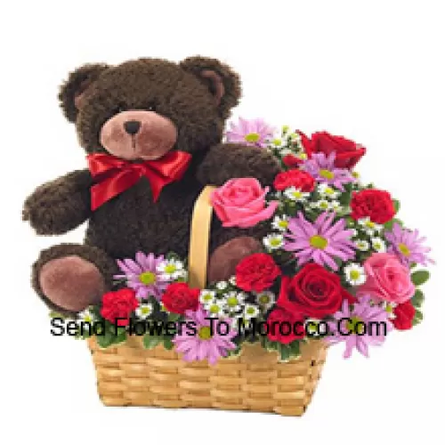 A Beautiful Basket Made Up Of Red And Pink Roses, Red Carnations And Other Assorted Purple Flowers Along With A Cute 14 Inches Tall Teddy Bear