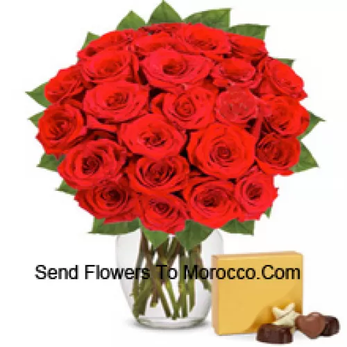 31 Red Roses With Some Ferns In A Glass Vase Accompanied With An Imported Box Of Chocolates