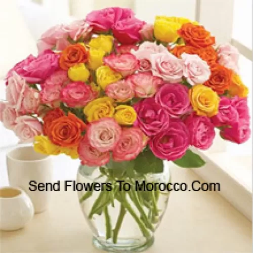 37 Mixed Colored Roses With Some Ferns In A Glass Vase