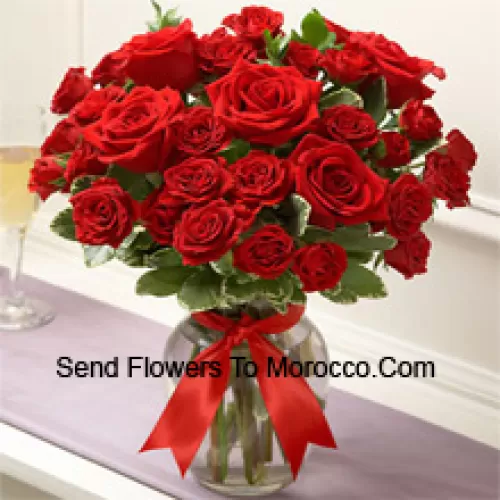 37 Red Roses With Some Ferns In A Glass Vase