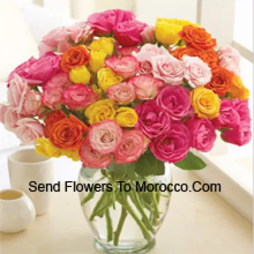 51 Mixed Colored Roses Arranged Beautifully In A Glass Vase