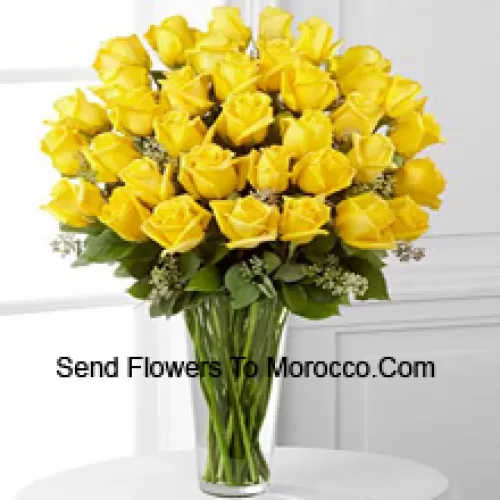 37 Yellow Roses With Some Ferns In A Glass Vase