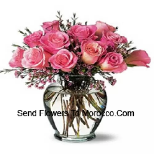 11 Pink Roses With Some Ferns In A Vase