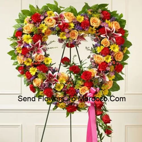 A Beautiful Heart Shaped Wreath That Comes With A Stand