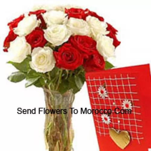 15 Red And 10 White Roses In A Glass Vase Accompanied With A Free Greeting Card