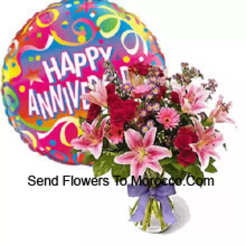 Assorted Flowers In A Vase Along With Anniversary Balloon