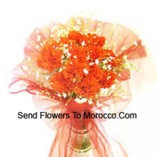 11 Orange Carnations With Some Ferns In A Vase