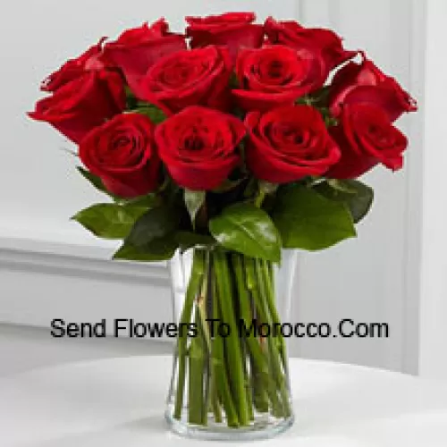 11 Red Roses With Some Ferns In A Vase