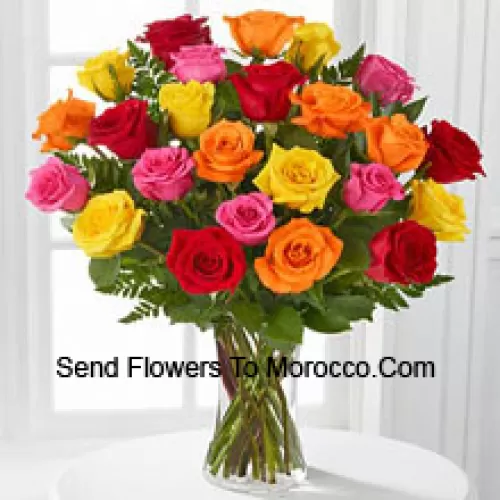 25 Mixed Colored Roses With Seasonal Fillers In A Glass Vase