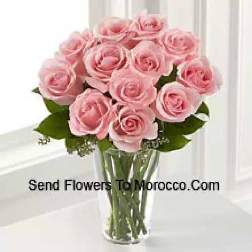 11 Pink Roses With Some Ferns In A Vase