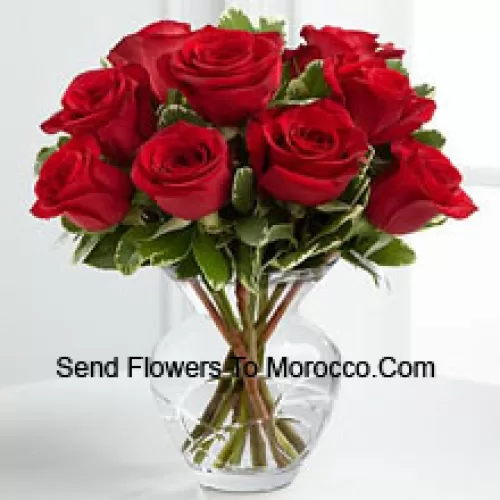 9 Red Roses With Some Ferns In A Vase