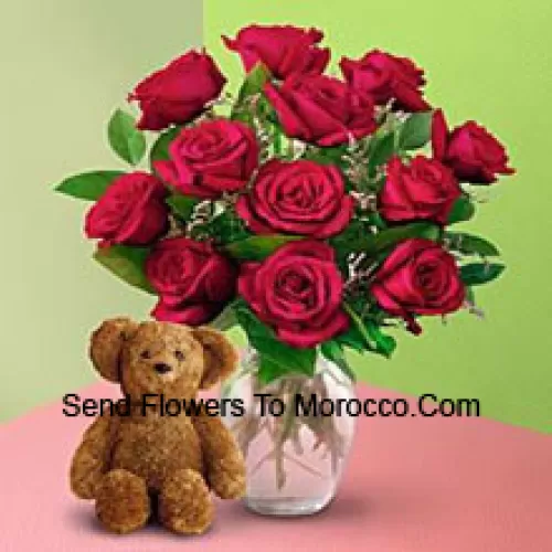 11 Red Roses With Some Ferns In A Vase And A Cute Brown 8 Inches Teddy Bear