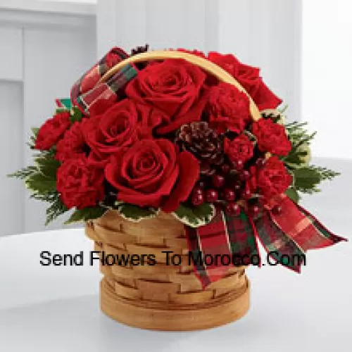 Greet your special recipient with seasonal beauty and blessings. Red roses and mini carnations are gorgeously arranged in a natural woodchip basket with assorted holiday greens, natural pinecones, and berry pics, accented with a tartan plaid ribbon to create a gift that wishes everything this wondrous season has to offer (Please Note That We Reserve The Right To Substitute Any Product With A Suitable Product Of Equal Value In Case Of Non-Availability Of A Certain Product)