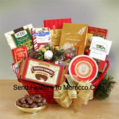 Everyone on your gift list this year will appreciate our gourmet sampler gift basket, whether it's family, friends, or business associates you need to please. Our handsome red oval basket comes decorated with a big bow and holiday greenery to make a great presentation. Inside are many reasons to smile as they sample the savory and sweet selection: crackers, cheese, Cashew Roca, truffle cookies, mocha almonds, chocolate chip cookies, Lindt truffles, Ghirardelli almond chocolate bar, and English tea cookies. (Please Note That We Reserve The Right To Substitute Any Product With A Suitable Product Of Equal Value In Case Of Non-Availability Of A Certain Product)