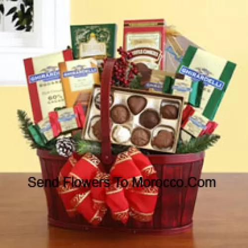 Our handsome red splitwood handle basket is all decked out in holiday splendor, and packed with a sweet sampling of Ghirardelli's greatest chocolate creations. There's plenty inside to discover and enjoy, and the sweet excess will keep your recipients smiling for days. We've included: two gift bags of Ghirardelli squares (mint chocolate & dark chocolate), truffle cookies, a caramel chocolate bar, hot cocoa mix, and an assortment of Ghirardelli chocolate squares. We top it off with a festive bow, and add silk greenery and accents to make sure this Christmas present is a memorable one (Please Note That We Reserve The Right To Substitute Any Product With A Suitable Product Of Equal Value In Case Of Non-Availability Of A Certain Product)