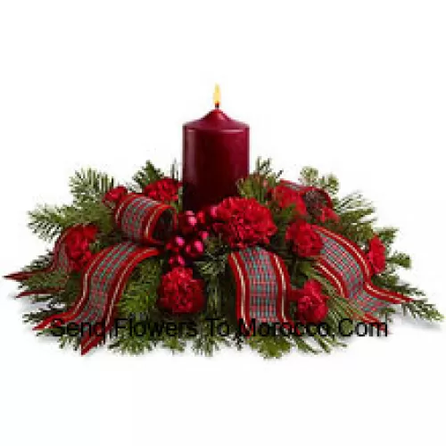 Celebrate a traditional family Christmas with this wonderful holiday centerpiece. Red carnations, fragrant evergreens and shiny ornament balls surround a red pillar candle, and a fancy ribbon adds a special touch! A lovely way to light the holiday table or a pretty sideboard decoration. (Please Note That We Reserve The Right To Substitute Any Product With A Suitable Product Of Equal Value In Case Of Non-Availability Of A Certain Product)